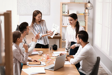 Team of professional journalists working in office