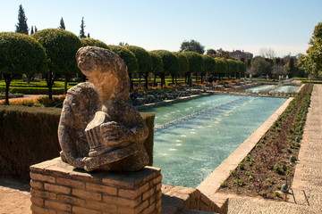 Cordoba Spain, statue and pool in the gardens of Alcazar of Cordoba
