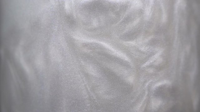 Rheoscopic fluid. Beautiful movement of particles in a liquid. Fantastic patterns and shapes. 50 fps