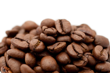 Roasted coffee beans in an orange cup