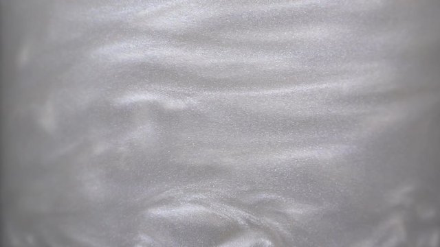 Rheoscopic fluid. Beautiful movement of particles in a liquid. Fantastic patterns and shapes. 50 fps
