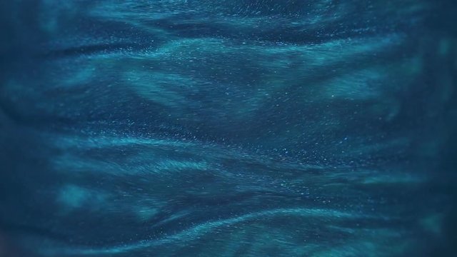 Rheoscopic fluid. Beautiful movement of particles in a liquid. Fantastic patterns and shapes. 50 fps