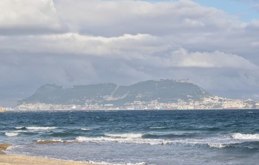Fototapeta na wymiar The Rock of Gibraltar, from Algeciras with clouds.