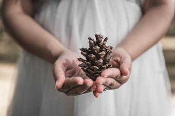 Pregnant woman and Husband  posing outdoors.