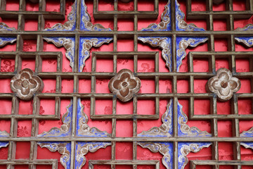 ancient wooden door relief in Wushan Water Curtain Caves, Gansu province , China.