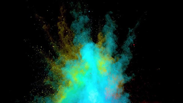 Realistic multicoloured powder explosion on black background. Tricolor burst in vertical motion