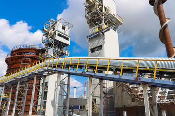 Metal iron structures, industrial production with a conveyor, pipes, railings and pipelines at the...