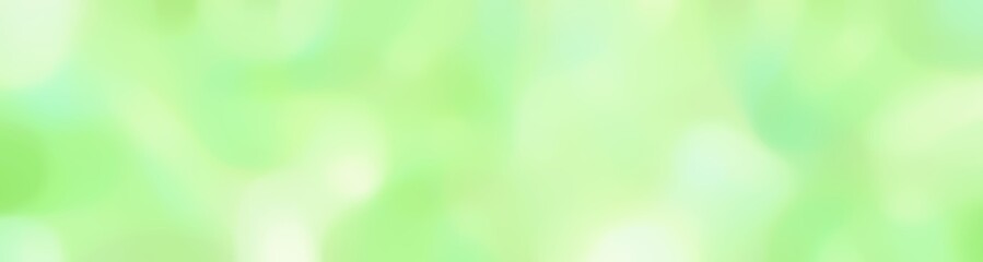 blurred horizontal background texture with tea green, beige and light golden rod yellow colors and free text space