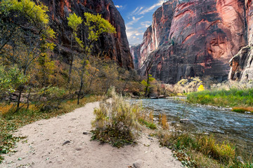 Trail views of the landscape and red rock mountain formations in the Narrows hiking trail in Zion National Park, near Springdale, Utah, USA. © S Quintans