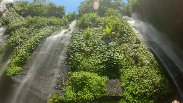 Beautiful Fiji waterfall on Bali island. Travel to Bali concept