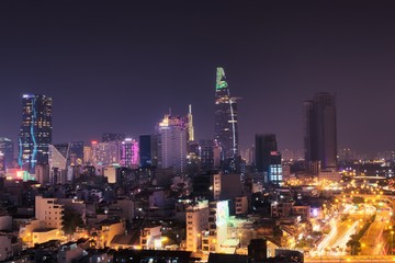 Fototapeta na wymiar Vibrant night shot of Saigon, Vietnam (Ho Chi Minh City). Long exposure elevated view.