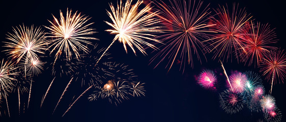colorful fireworks on the black sky background with free space for text. Celebration and anniversary concept