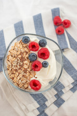 Granola with yogurt and berries for healthy breakfast