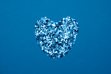 Valentines day card in blue trendy color - heart made of confetti