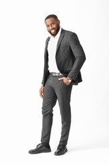 Stylish African-American man on white background