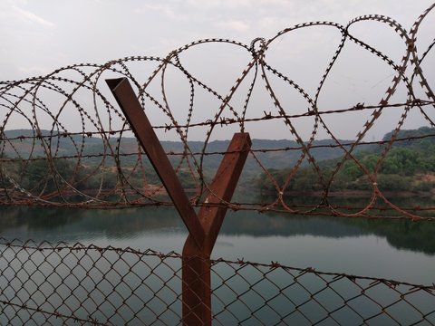 Jammu, Jammu And Kashmir/India- January 08 2020: Lockdown Over Civilian Quarters Near The Lake. Border Fence To Secure A Boundary. 