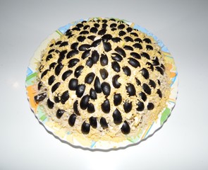 smoked chicken sunflower salad garnished with olives obside on a white background