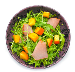 Plate with tasty salad on white background