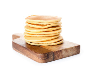 Board with stack of tasty pancakes on white background