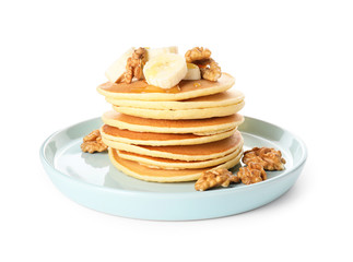 Plate with stack of tasty pancakes on white background