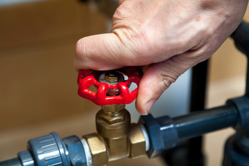Hand spins valve close-up