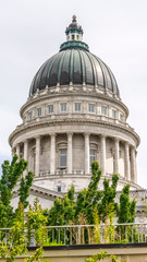 Fototapeta premium Vertical frame Famous dome of Utah State Capitol Building against cloudy sky in Salt Lake City