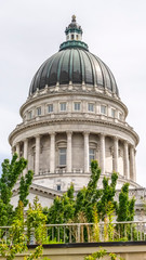 Vertical frame Famous dome of Utah State Capitol Building against cloudy sky in Salt Lake City