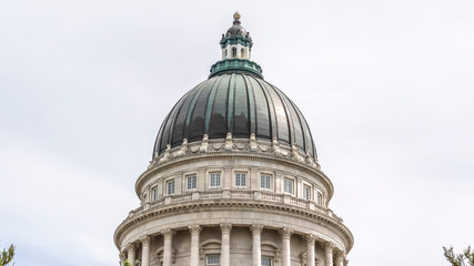 Panorama Famous dome of Utah State Capitol Building against cloudy sky in Salt Lake City