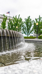 Vertical Circular water fountain with Utah State Capital Building in Salt Lake City