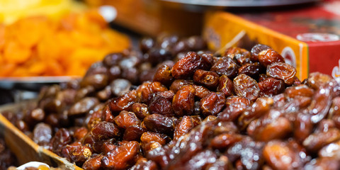 Fresh local dates for sale at a local market, Fez, Morocco. With selective focus.