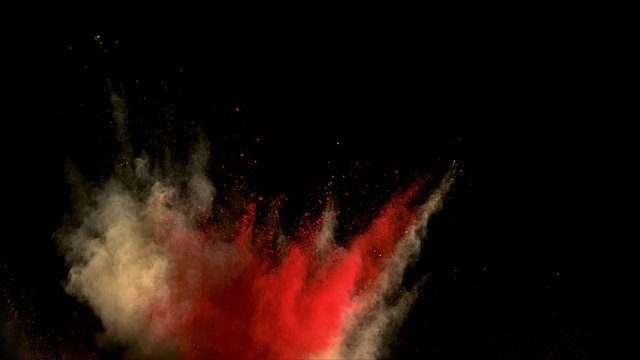 Realistic brown and red powder explosion on black background. Slow motion movement with subtle acceleration 