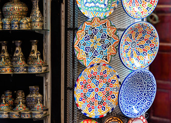 Traditional painted plates in the local market, Fez, Morocco. With selective focus.