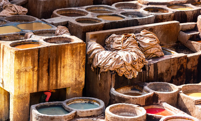 Dye reservoirs and vats in traditional tannery of city of Fez, Morocco.