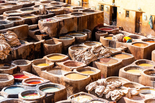 Dye reservoirs and vats in traditional tannery of city of Fez, Morocco.