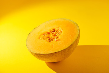 Cantaloupe on yellow background