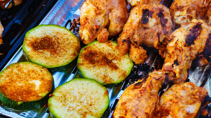 Chicken meat grilling on gas grill