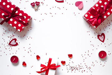 Frame of gifts, Souvenirs, candles, confetti on a white background. The background of Valentine's day