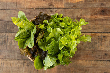 Fresh vegetables grown using natural methods, without chemicals, beautiful, colorful, arranged in baskets and placed on wooden tables to look appetizing.