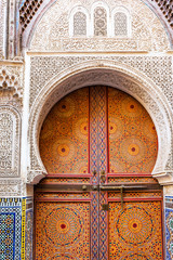 Wooden door in oriental style, Fez, Morocco. Vertical.