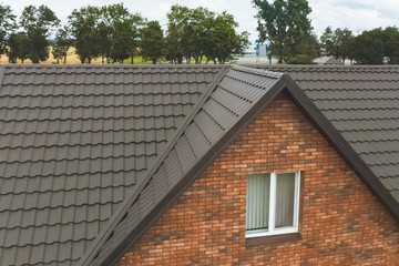 House with a brown metal roof.Corrugated metal roof and metal ro