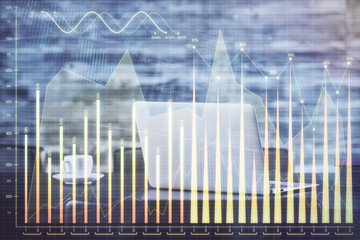 Forex market graph hologram and personal computer on background. Multi exposure. Concept of investment.
