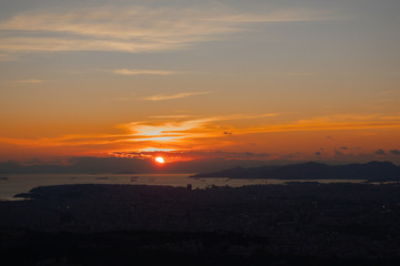 Sunset in Athens on a cloudy sky with a city view from Lycabettus hill