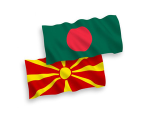 National vector fabric wave flags of Bangladesh and North Macedonia isolated on white background. 1 to 2 proportion.