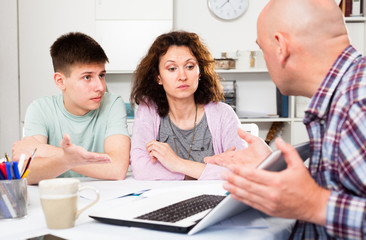 Family with son working with papers