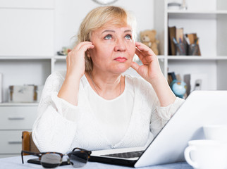 Mature woman with laptop