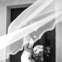 The Kiss. Bride and groom kisses tenderly in the shadow of a flying veil. Close up portrait of sexy...