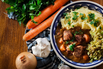 Traditional irish stew served with potatoes and cabbage - 314219536