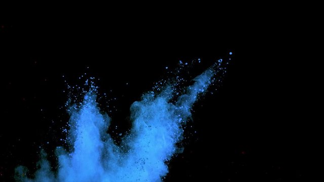 Realistic blue powder explosion on black background. Slow motion movement with subtle acceleration 