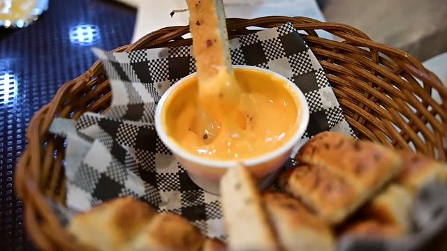 bread stick dip with sauce and cheese