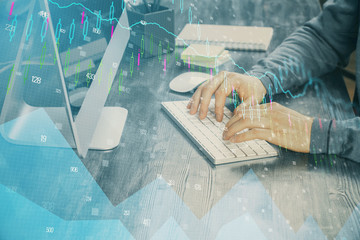 Double exposure of financial graph with man works in office on background. Concept of analysis.